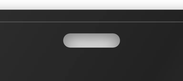 Close view of the 12 by 3 millimetre reel slot punched through the top of the card.